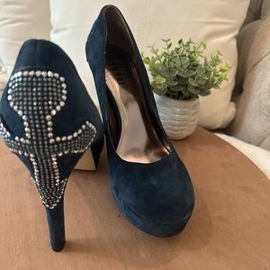 Reba suede navy high heels with cross detail on the back